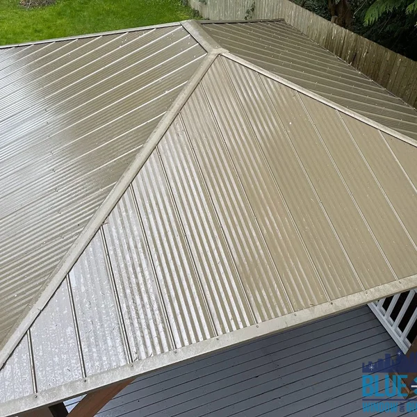 Cleaned metal roof on a gazebo after residential soft wash cleaning by exterior maintenance professionals.