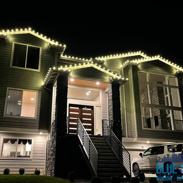 Residential home with roofline Christmas lights, showcasing professional exterior holiday lighting services.