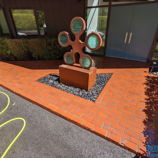 Clean brick walkway leads to a commercial building entrance after professional surface cleaning service.