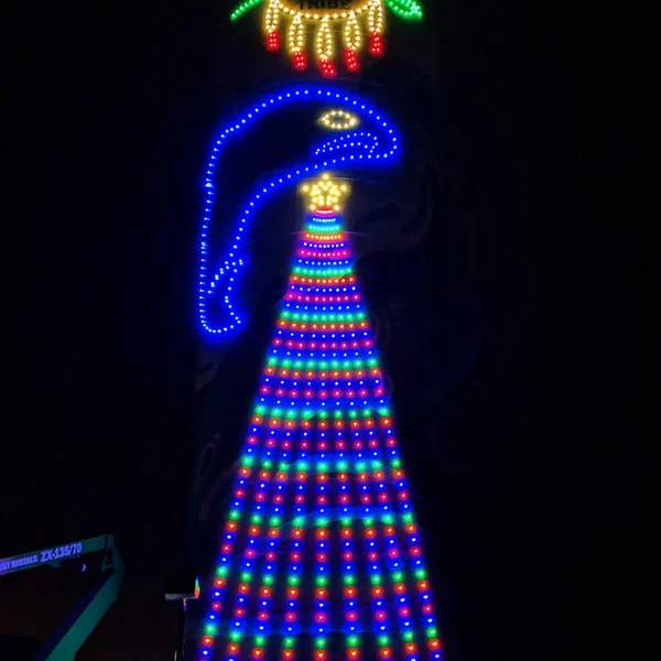 Commercial building displays bright, colorful LED Christmas lights installed by our exterior maintenance team.