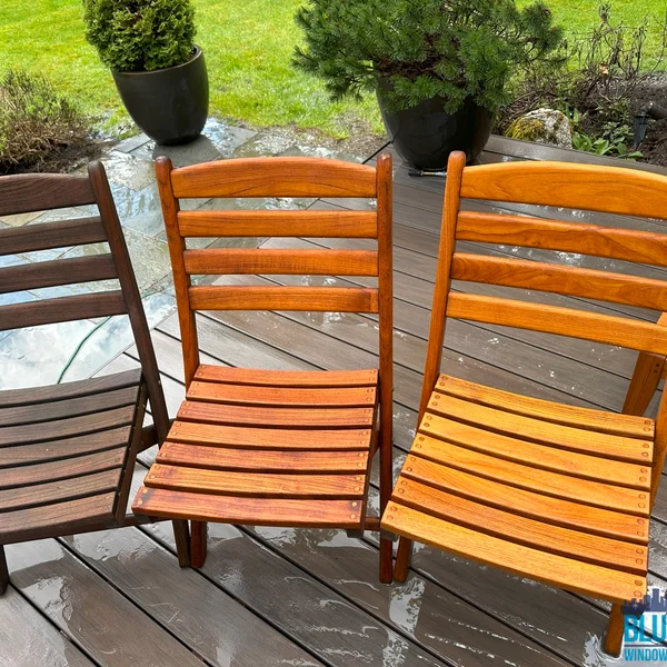 Residential wood restoration: Three chairs show color change after professional pressure washing and restoration.