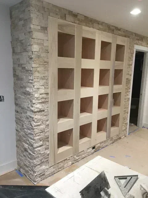 Stone fireplace construction for home addition in Seattle