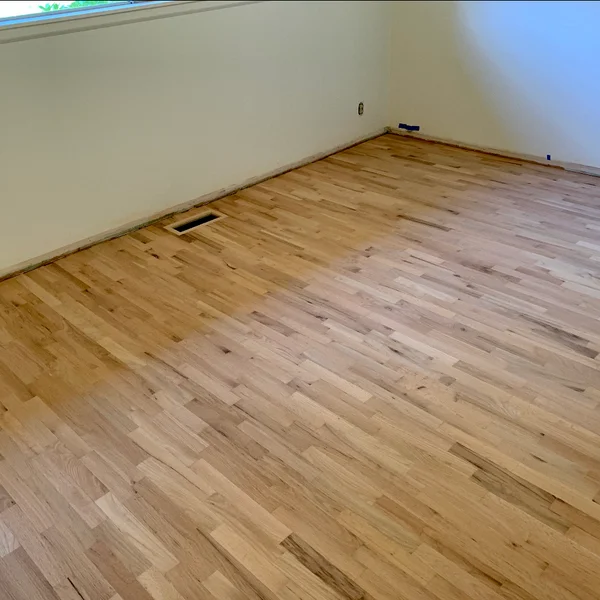 Newly installed light hardwood flooring enhances this renovated Seattle home interior.