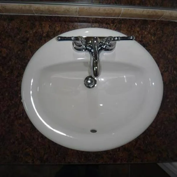 This round, white sink and chrome faucet is a standard feature in our ADUs and park model bathrooms.