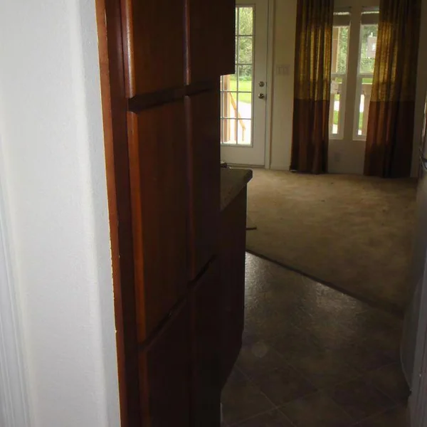 Step inside a cozy manufactured home; this entryway offers a glimpse of a simple yet functional living space, complete with stylish accents.