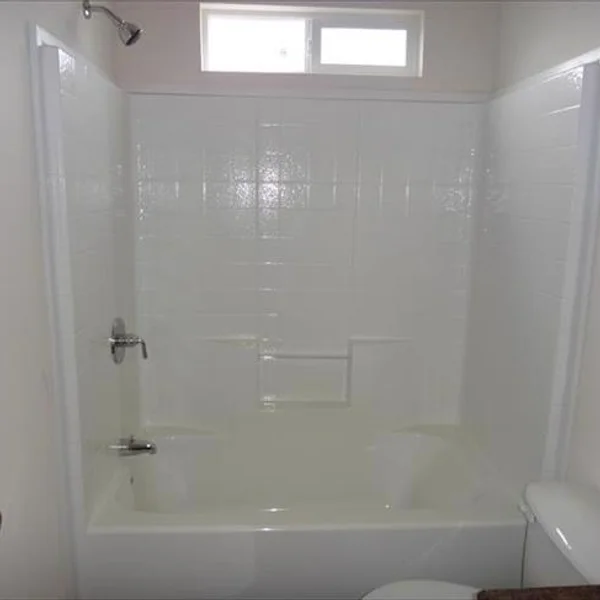 A well-lit, pristine bathroom is just one of the many features of this ADU, manufactured home, or tiny home design.