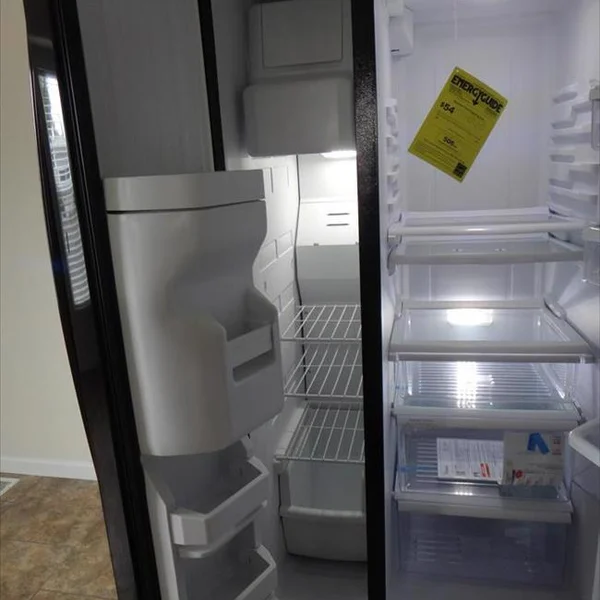 A clean and spacious refrigerator is featured inside this modern manufactured home, providing efficient food storage.