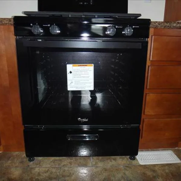 This sleek, black Whirlpool oven is included with many park model homes and ADUs for modern cooking.