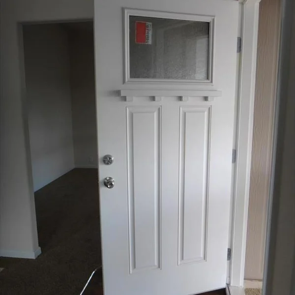 This attractive white entry door offers natural light and a classic design for your new Accessory Dwelling Unit or park model home.