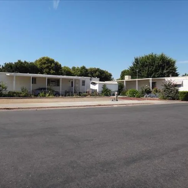 Explore the affordability and comfort of our park model homes, designed with covered porches for enjoying community living.